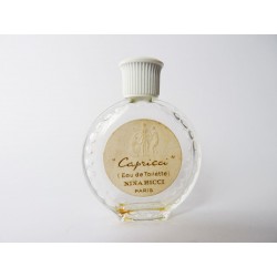 Miniature de parfum Capricci de Nina Ricci flacon montre